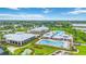 Aerial view showcases pools, clubhouse, miniature golf, and well-maintained landscaping in this vibrant community at 2423 Datura Loop, St Cloud, FL 34772