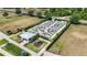 Community garden with raised garden beds, shaded seating area, and paved walkways offers outdoor space at 2423 Datura Loop, St Cloud, FL 34772