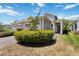 Well-maintained home featuring a two-car garage and a beautifully paved driveway, green lawn and charming entryway at 2423 Datura Loop, St Cloud, FL 34772