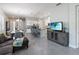 Open-concept living space featuring a kitchen with an island and dining area, filled with natural light at 2423 Datura Loop, St Cloud, FL 34772