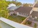 Aerial view of the fenced backyard featuring a patio area and well-maintained lawn at 2504 London Bridge Ct, Orlando, FL 32837