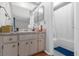 Bathroom featuring a vanity with cabinet storage and a shower/tub combo at 2504 London Bridge Ct, Orlando, FL 32837