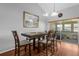 Charming dining room with modern table set and sliding glass doors to outdoor patio at 2504 London Bridge Ct, Orlando, FL 32837