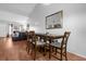 Dining area features a wooden table with seating for four, plus modern decor at 2504 London Bridge Ct, Orlando, FL 32837