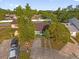 Aerial view of a well-maintained home with mature landscaping and a spacious driveway at 2504 London Bridge Ct, Orlando, FL 32837