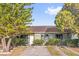 Charming single-story home featuring tidy landscaping and a welcoming front entrance with a defined walkway at 2504 London Bridge Ct, Orlando, FL 32837