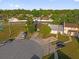 Aerial view of the home featuring mature trees and landscaping and driveway parking at 2504 London Bridge Ct, Orlando, FL 32837
