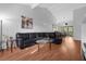 Open-concept living room showcasing hardwood floors, modern decor, and a seamless flow into the dining area at 2504 London Bridge Ct, Orlando, FL 32837