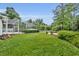 The spacious backyard features well-maintained landscaping and a screened pool area for outdoor enjoyment at 2610 Cloudcroft Dr, Apopka, FL 32703