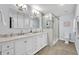 Bathroom with double vanity, marble countertops and glass shower at 2610 Cloudcroft Dr, Apopka, FL 32703