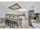 Modern kitchen with white cabinets, granite countertops, and a breakfast bar with seating at 2610 Cloudcroft Dr, Apopka, FL 32703