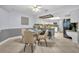 Cozy eat-in kitchen featuring a tile floor, bead-board wainscotting, and modern appliances at 2610 Cloudcroft Dr, Apopka, FL 32703