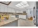 Bright kitchen with white cabinets, mosaic backsplash, and stainless steel appliances at 2610 Cloudcroft Dr, Apopka, FL 32703