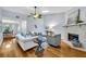 Cozy living room with a fireplace, hardwood floors, and a neutral color palette at 2610 Cloudcroft Dr, Apopka, FL 32703