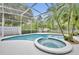 A stunning pool with a spa and lush landscaping provides a tranquil retreat at 2610 Cloudcroft Dr, Apopka, FL 32703