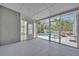 View of screened porch with access to a private pool area with well-maintained landscaping at 2610 Cloudcroft Dr, Apopka, FL 32703