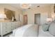 Well-lit bedroom showing a dresser, closet, and calming color scheme at 2745 Serenity Meadow Dr, Kissimmee, FL 34744