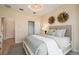 Cozy bedroom featuring a comfortable bed, a closet, and decorative wall art at 2745 Serenity Meadow Dr, Kissimmee, FL 34744