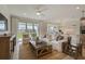 Cozy living room featuring plush seating, neutral decor, and view of the backyard at 2745 Serenity Meadow Dr, Kissimmee, FL 34744