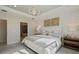 Comfortable bedroom with accent wall, tray ceiling and view into the en suite bathroom at 2745 Serenity Meadow Dr, Kissimmee, FL 34744