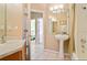 Bathroom featuring a bathtub-shower combo, vanity with sink, and neutral decor at 2918 Sunset Vista Blvd, Kissimmee, FL 34747