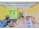 The converted garage boasts a ' recreational area, games, and television; perfect for Gathering fun at 2918 Sunset Vista Blvd, Kissimmee, FL 34747