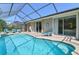 Beautiful, sparkling pool with attached patio, lounge chairs, and tropical foliage; ideal for relaxation at 2918 Sunset Vista Blvd, Kissimmee, FL 34747