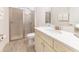 Elegant bathroom with tiled shower, marble vanity, and modern fixtures at 2988 Salted Rim Rd, Kissimmee, FL 34747