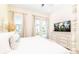 Bright bedroom with balcony, large screen TV, and comfortable furnishings at 2988 Salted Rim Rd, Kissimmee, FL 34747