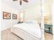Stylish bedroom with decorative art, soft lighting, and a comfortable four-poster bed at 2988 Salted Rim Rd, Kissimmee, FL 34747