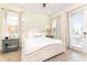 Serene bedroom features a four-poster bed, soft lighting, and access to a private balcony at 2988 Salted Rim Rd, Kissimmee, FL 34747