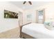 Cozy bedroom featuring a TV, queen bed with wood frame, and beach-themed decor at 2988 Salted Rim Rd, Kissimmee, FL 34747