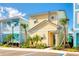 Charming colorful two-story home with manicured landscaping and accessible parking space at 2988 Salted Rim Rd, Kissimmee, FL 34747