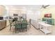 Open-concept living room and kitchen with modern appliances and stylish furnishings at 2988 Salted Rim Rd, Kissimmee, FL 34747