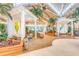 Grand lobby with tropical decor, high ceilings, lush greenery, and unique seating areas for a luxurious resort ambiance at 2988 Salted Rim Rd, Kissimmee, FL 34747