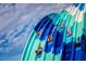 Thrill-seekers enjoy a colorful water slide with twists, turns, and splashes for an unforgettable aquatic adventure at 2988 Salted Rim Rd, Kissimmee, FL 34747