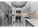 Well-lit kitchen featuring stainless steel appliances, ample counter space, and white cabinetry for a clean, modern look at 3078 Isles Way, New Smyrna Beach, FL 32168