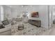 Open-plan living room features a coastal vibe with whitewashed furniture and luxury vinyl floors at 3078 Isles Way, New Smyrna Beach, FL 32168