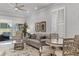Bright living room features backyard access, neutral tones and plantation shutters at 3078 Isles Way, New Smyrna Beach, FL 32168