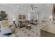Bright living room features contemporary furnishings, ceiling fan, and an area rug at 3078 Isles Way, New Smyrna Beach, FL 32168