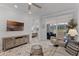 Living room featuring backyard access, TV, and view to the bedroom at 3078 Isles Way, New Smyrna Beach, FL 32168