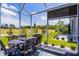 Covered patio with outdoor seating and views of the golf course at 3078 Isles Way, New Smyrna Beach, FL 32168