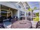 Relaxing screened patio with dining set and sitting area, perfect for outdoor enjoyment at 3078 Isles Way, New Smyrna Beach, FL 32168