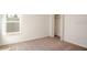 Bedroom featuring carpet flooring and a window providing natural light at 3242 Viceroy Ct, Poinciana, FL 34759