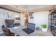 Comfortable home office featuring a large wooden desk, nautical decor and lots of natural light at 3242 Viceroy Ct, Poinciana, FL 34759