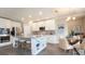 Modern kitchen with stainless steel appliances, granite countertops, and a central island with seating at 3242 Viceroy Ct, Poinciana, FL 34759