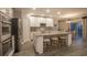 Modern kitchen with stainless steel appliances, granite countertops, and a central island with seating at 3242 Viceroy Ct, Poinciana, FL 34759