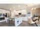 Modern kitchen with stainless steel appliances, granite countertops, and a central island with seating at 3242 Viceroy Ct, Poinciana, FL 34759