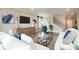 Bright open-concept living room with hardwood floors and comfortable seating at 3242 Viceroy Ct, Poinciana, FL 34759