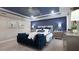 Spacious main bedroom features a tray ceiling, a sitting area, and neutral decor at 3242 Viceroy Ct, Poinciana, FL 34759